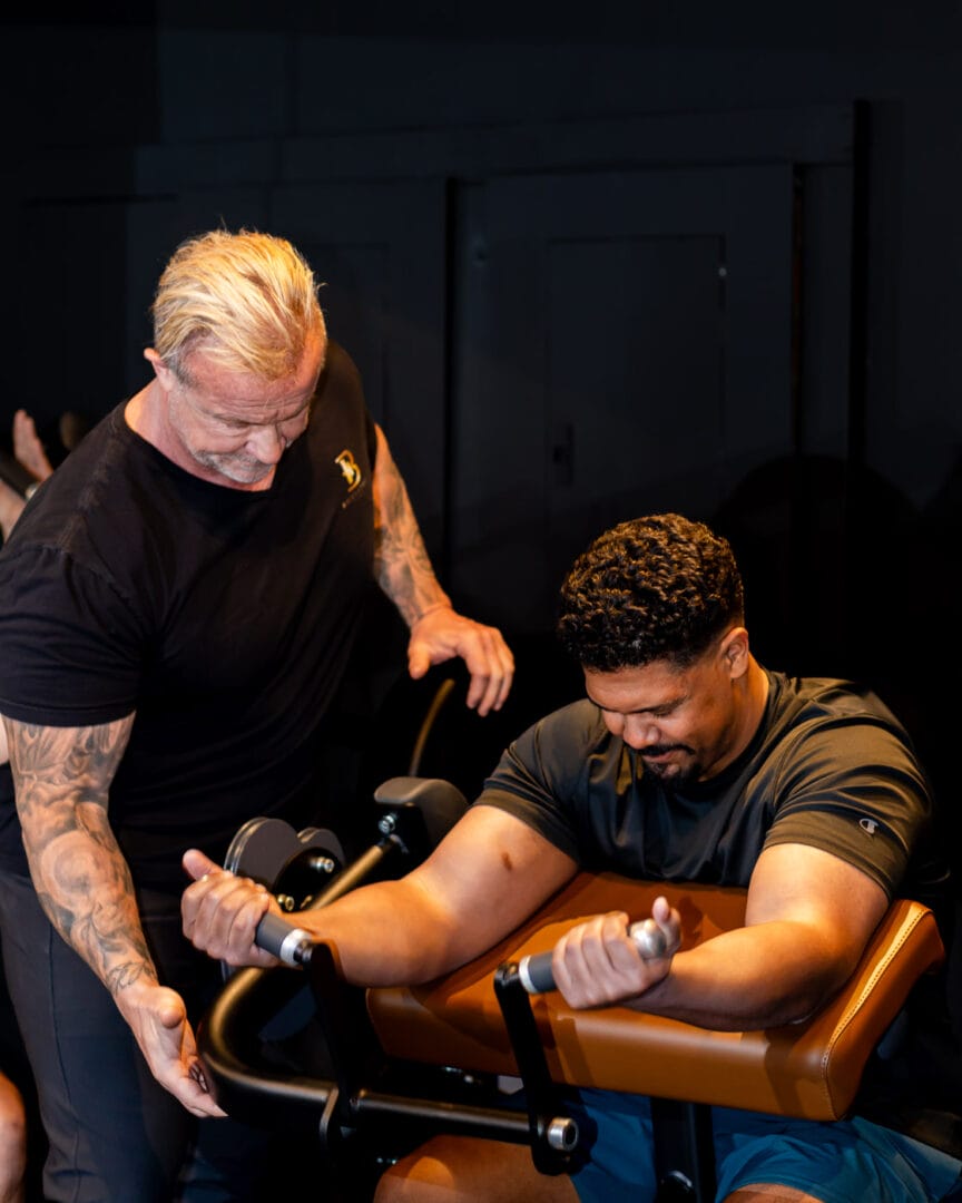 Personal trainer in Clearwater coaching a client on proper exercise form and technique at Bodystyle Fitness.